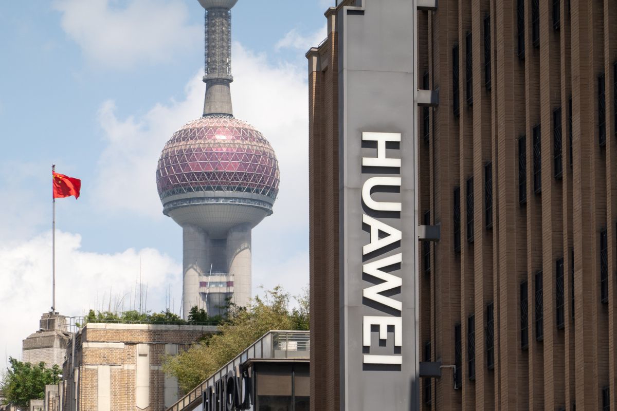 The logo of Huawei's global flagship store is being displayed on the pedestrian street of Nanjing Road in the Huangpu district of Shanghai, China, on May 8, 2024. The Oriental Pearl Tower in Lujiazui is visible in the background to the left.