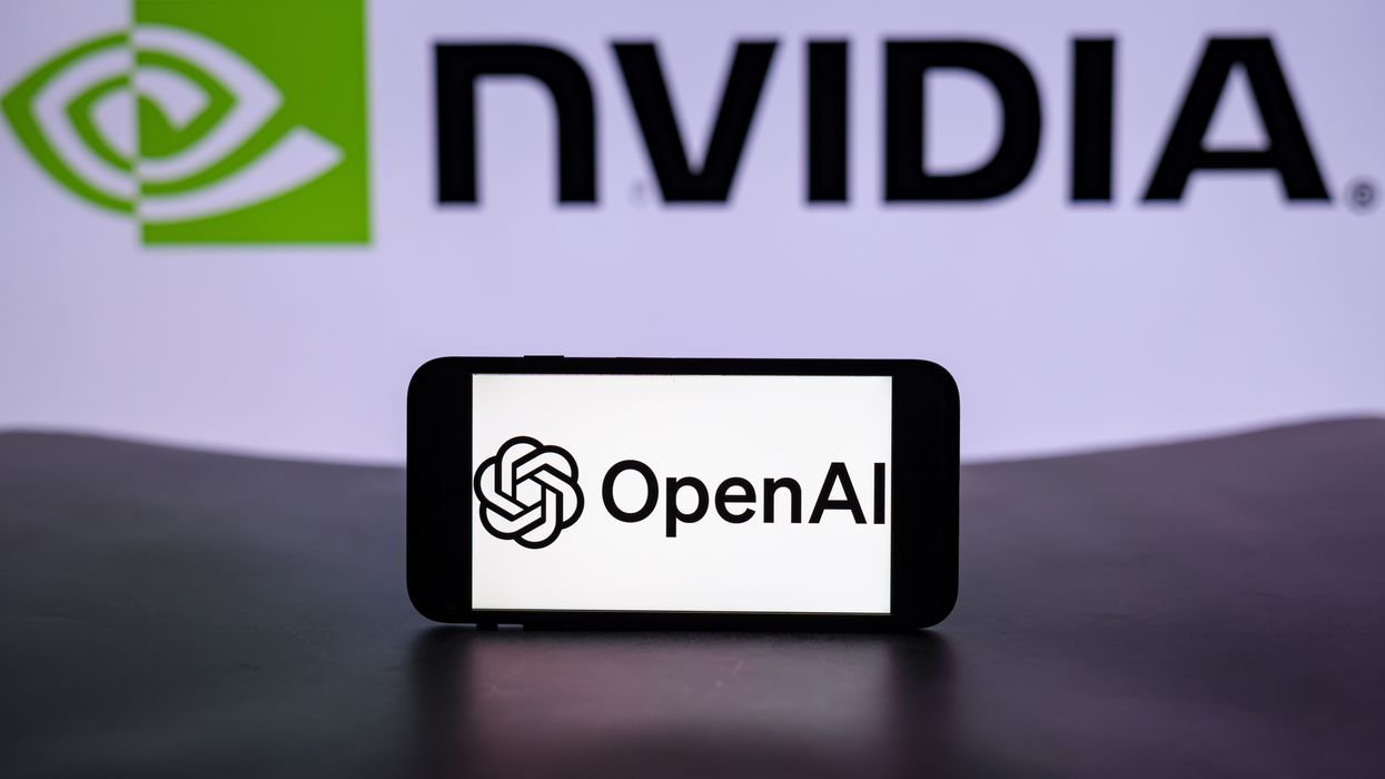 The logo of OpenAI is seen displayed on a mobile phone screen with the Nvidia logo in the background.