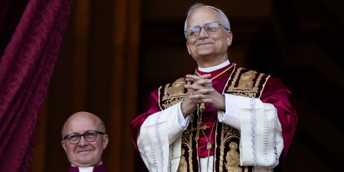 The newly elected Pope Leo XIV (r), US-American Robert Prevost, appears on the balcony of St. Peter's Basilica in the Vatican after the conclave.