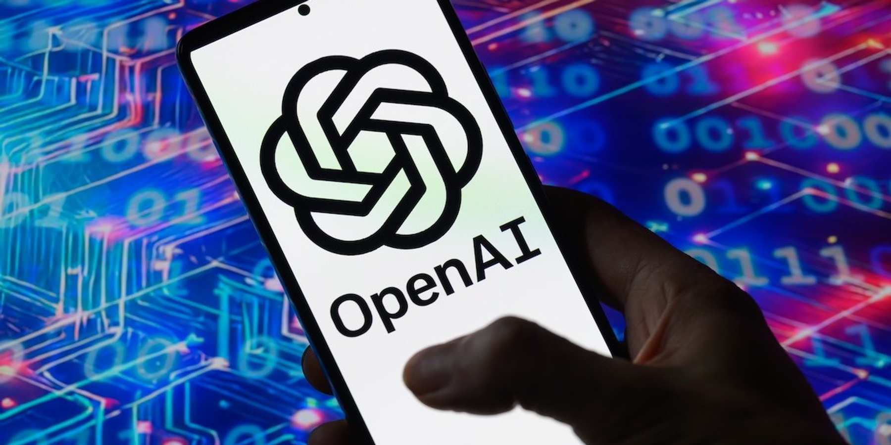 The OpenAi logo is displayed on a mobile screen in this photo illustration.