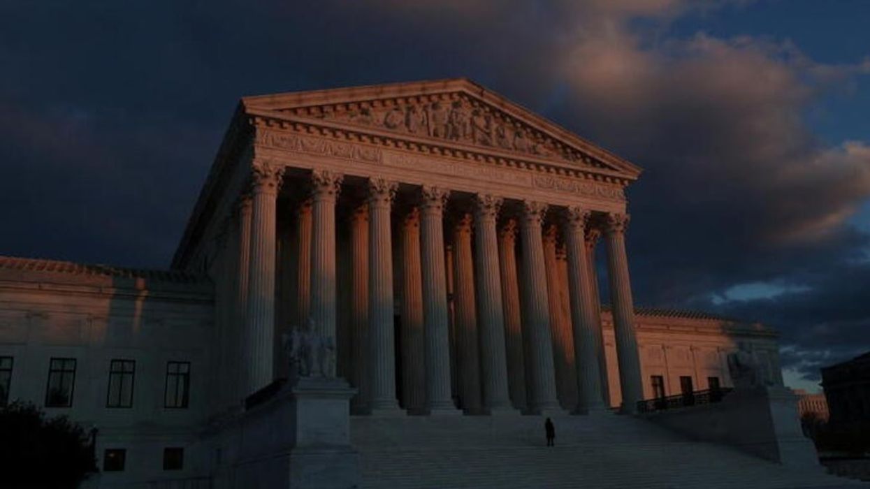 The sun sets at the U.S. Supreme Court building the week that the court is expected to hear arguments in a Mississippi case that challenges Roe v. Wade in Washington, U.S., November 29, 2021.