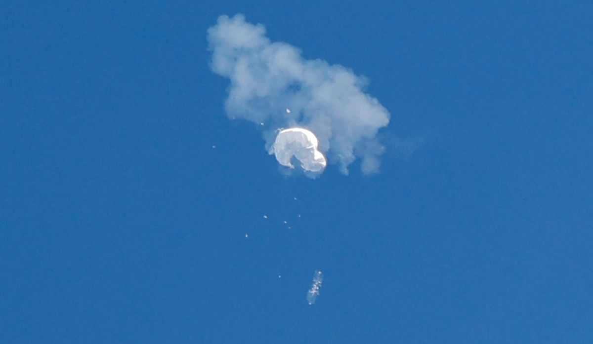 The suspected Chinese spy balloon drifts to the ocean after being shot down off the coast in Surfside Beach, South Carolina. 