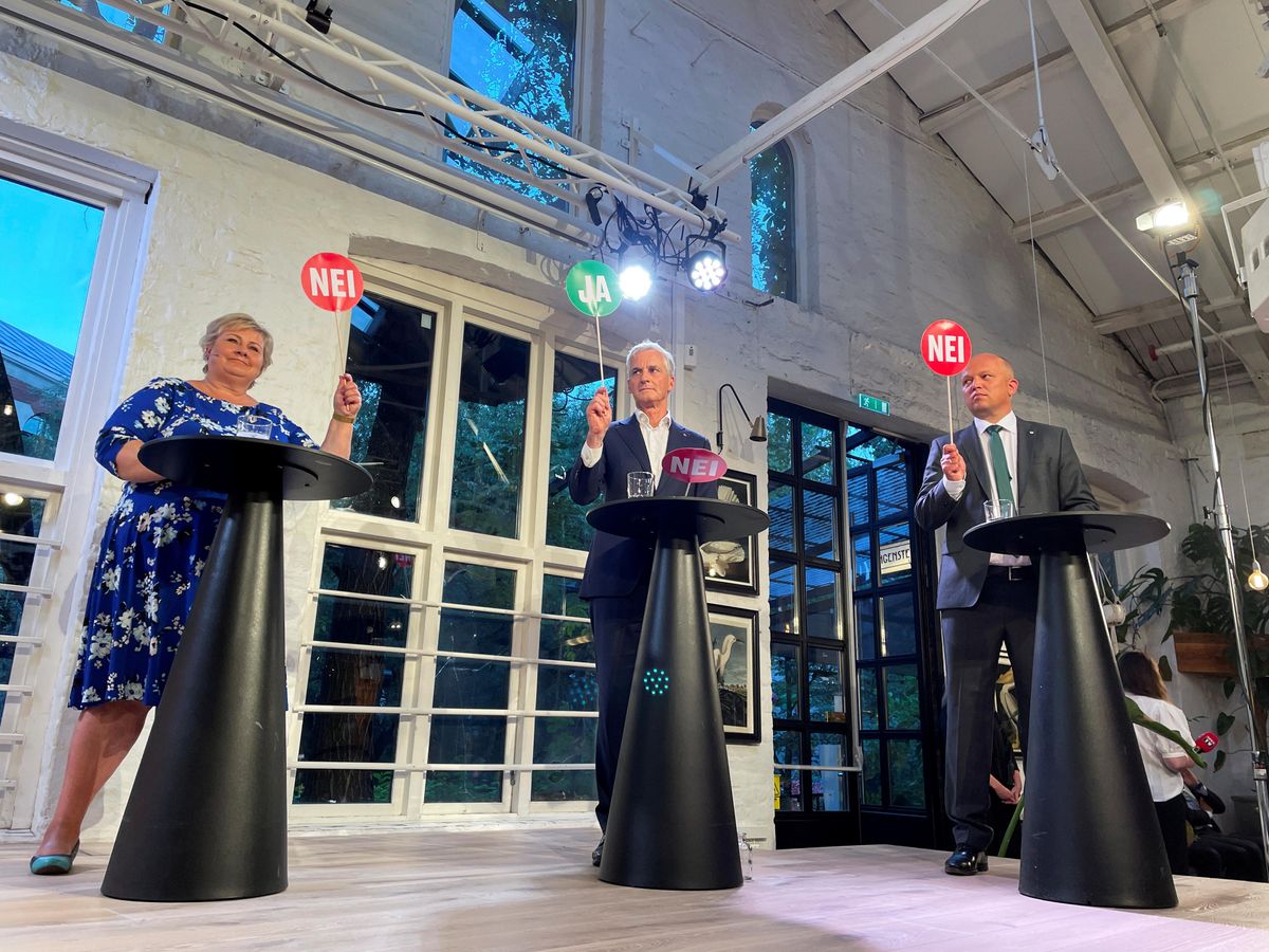 The three candidates for Norway's prime minister Erna Solberg from the Conservatives, Jonas Gahr Stoere from Labour Party and Trygve Slagsvold Vedum from the Centre Party attend a debate in central Oslo, Norway August 9, 2021