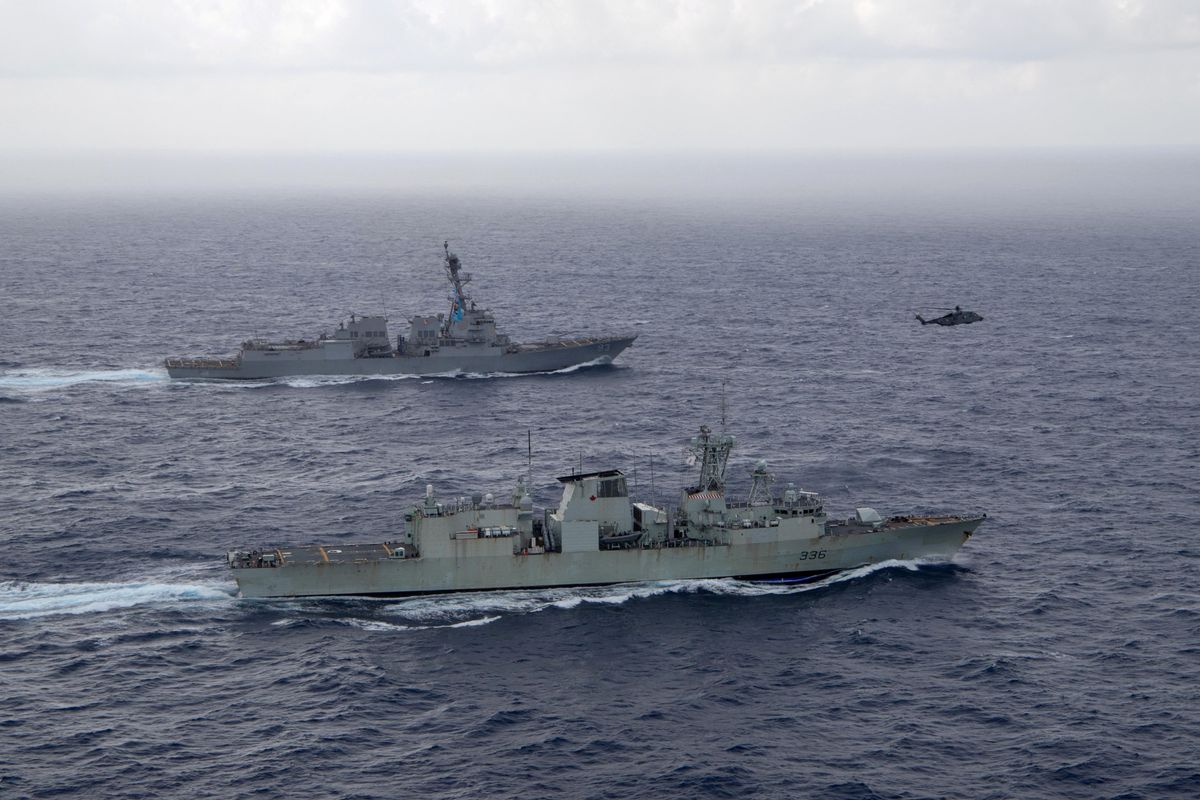 The US Navy guided-missile destroyer USS Chung-Hoon sails alongside the Royal Canadian Navy frigate HMCS Montreal during Surface Action Group operations as a part of exercise “Noble Wolverine" in the South China Sea.