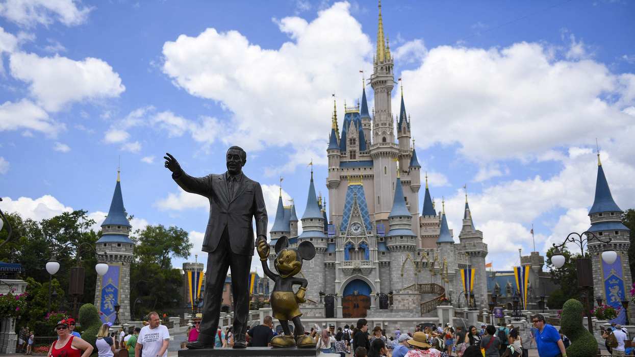 The Walt Disney and Mickey Mouse "Partners" statue outside Cinderella's Castle at Disney World's Magic Kingdom. 