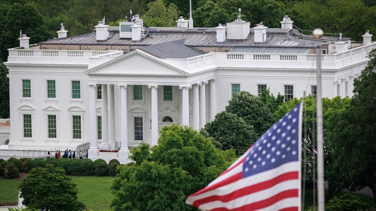 The White House is seen from a nearby building rooftop.