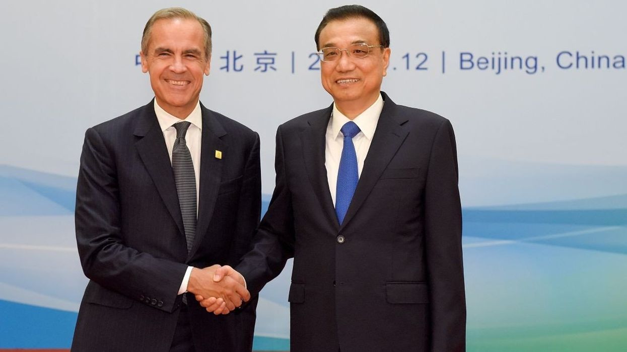 Then-Bank of England Governor Mark Carney shakes hands with then-Chinese Premier Li Keqiang in Beijing, China, on September 12, 2017.