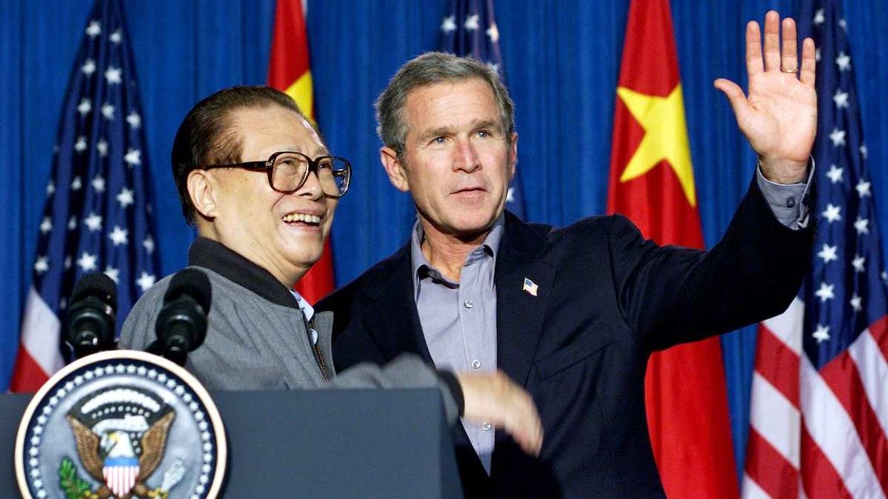 Then-US President George W. Bush with then-People's Republic of China President Jiang Zemin following their meeting at Bush's ranch in Crawford, Texas, on October 25, 2002.