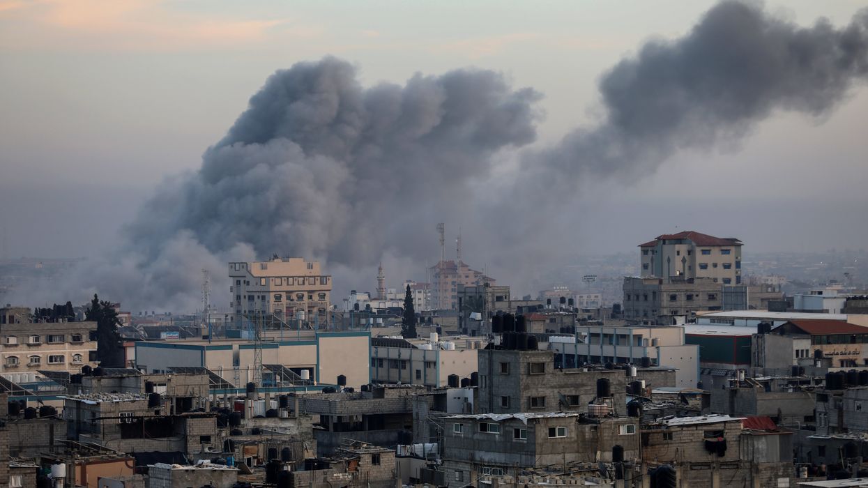 Thick smoke rises from buildings after an Israeli air strike on the city of Rafah in the southern Gaza Strip.