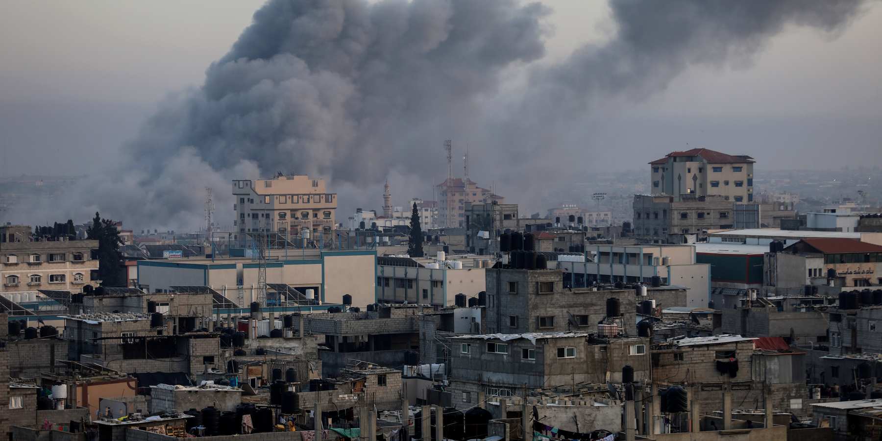 Thick smoke rises from buildings after an Israeli air strike on the city of Rafah in the southern Gaza Strip.