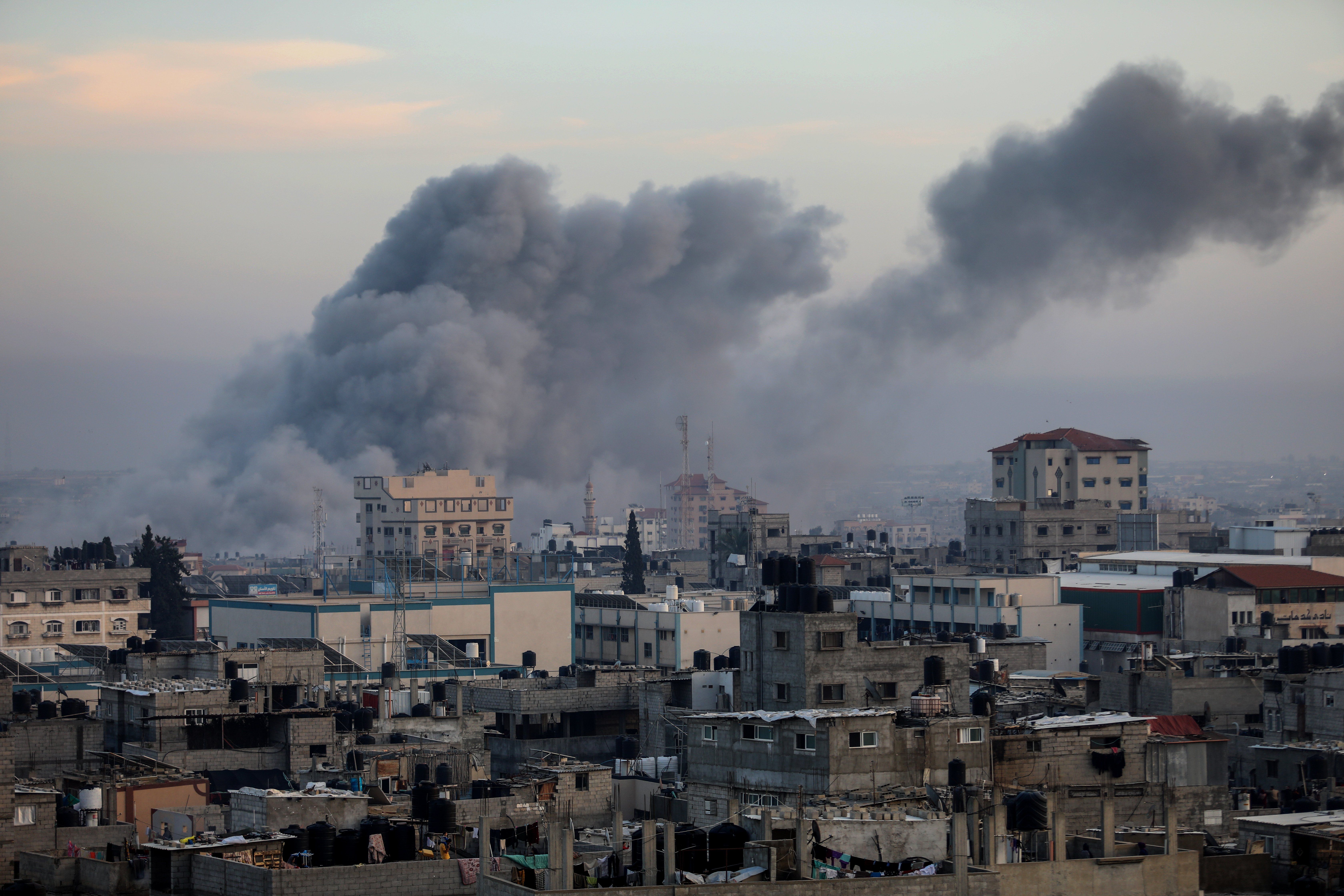Thick smoke rises from buildings after an Israeli air strike on the city of Rafah in the southern Gaza Strip.