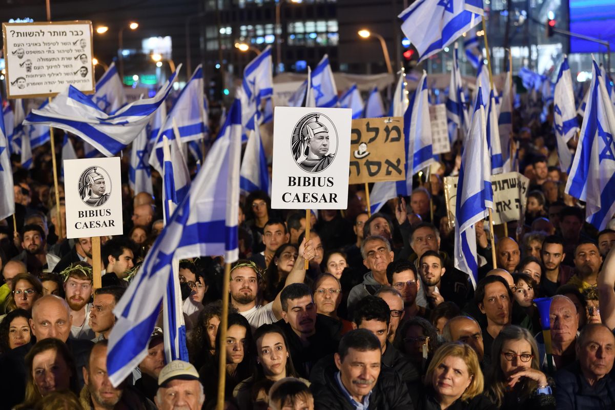 Thousands of Israeli protesters rally against PM Benjamin Netanyahu's new government in Tel Aviv.