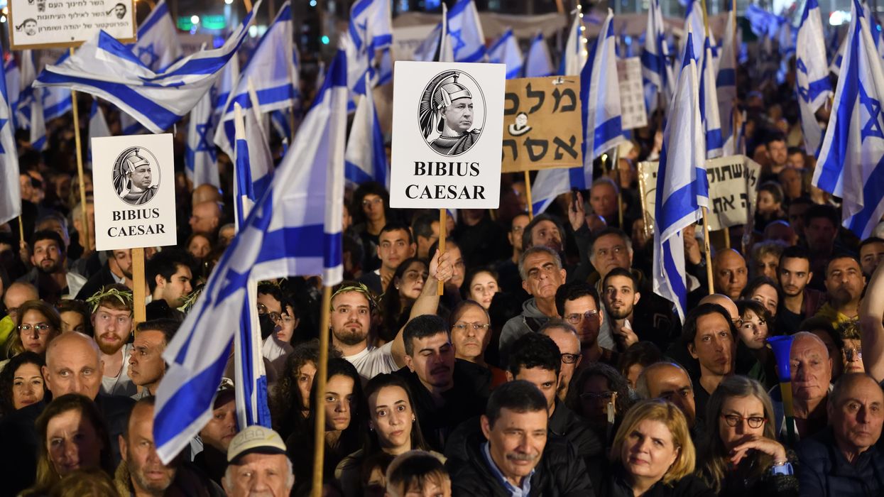 Thousands of Israeli protesters rally against PM Benjamin Netanyahu's new government in Tel Aviv.