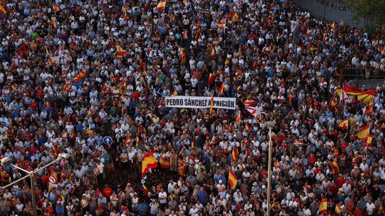 Thousands of people gather at the Palacio de Cibeles, seat of the Madrid City Council, in Madrid, Spain during demonstrations held outside city halls in autonomous communities across Spain in protest of the mass entry of migrants at the Ceuta border.