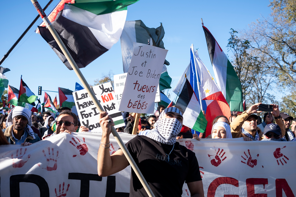 Thousands protest Israel's war against Hamas in front of the monument to Sir George-Etienne Cartier in Montreal, carrying placards calling out Joe Biden and Justin Trudeau for their support of Israel. 