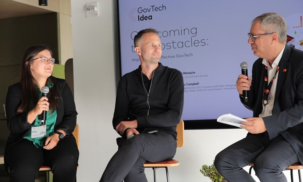 Three people speaking in a panel