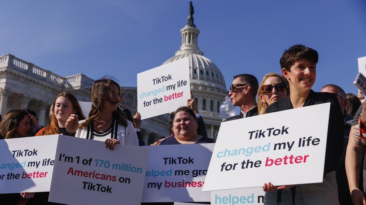 ​TikTok creators are holding signs in support of the app and against a ban in Washington, D.C., on March 12, 2024, ahead of a scheduled vote tomorrow in the House of Representatives that would ban the social media app until it divests from Chinese ownership. 