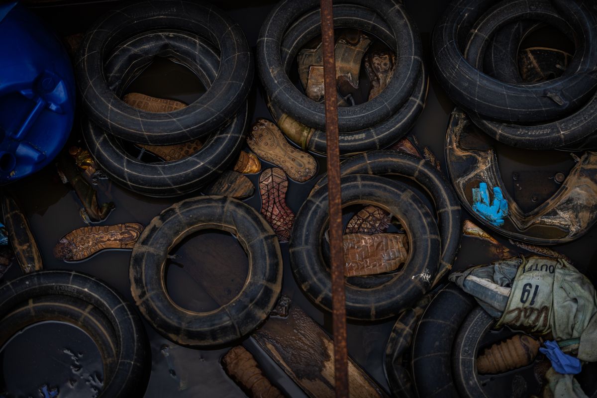 Tire tubes used as improvised lifebuoys, as well as shoes and clothes, lie in a boat in which migrants from the northern coast of Africa crossed the Mediterranean Sea to the Italian island of Lampedusa.