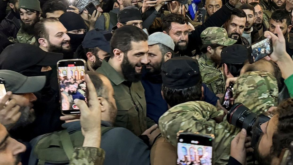 Top rebel commander Abu Mohammed al-Golani greets the crowd at Ummayad Mosque in Damascus after Syrian rebels announced that they have ousted President Bashar Assad, on Dec. 8, 2024.