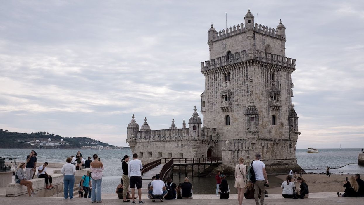 Tourists visit the Torre de Belem (Belem Tower) in Lisbon, Portugal on October 19, 2021.