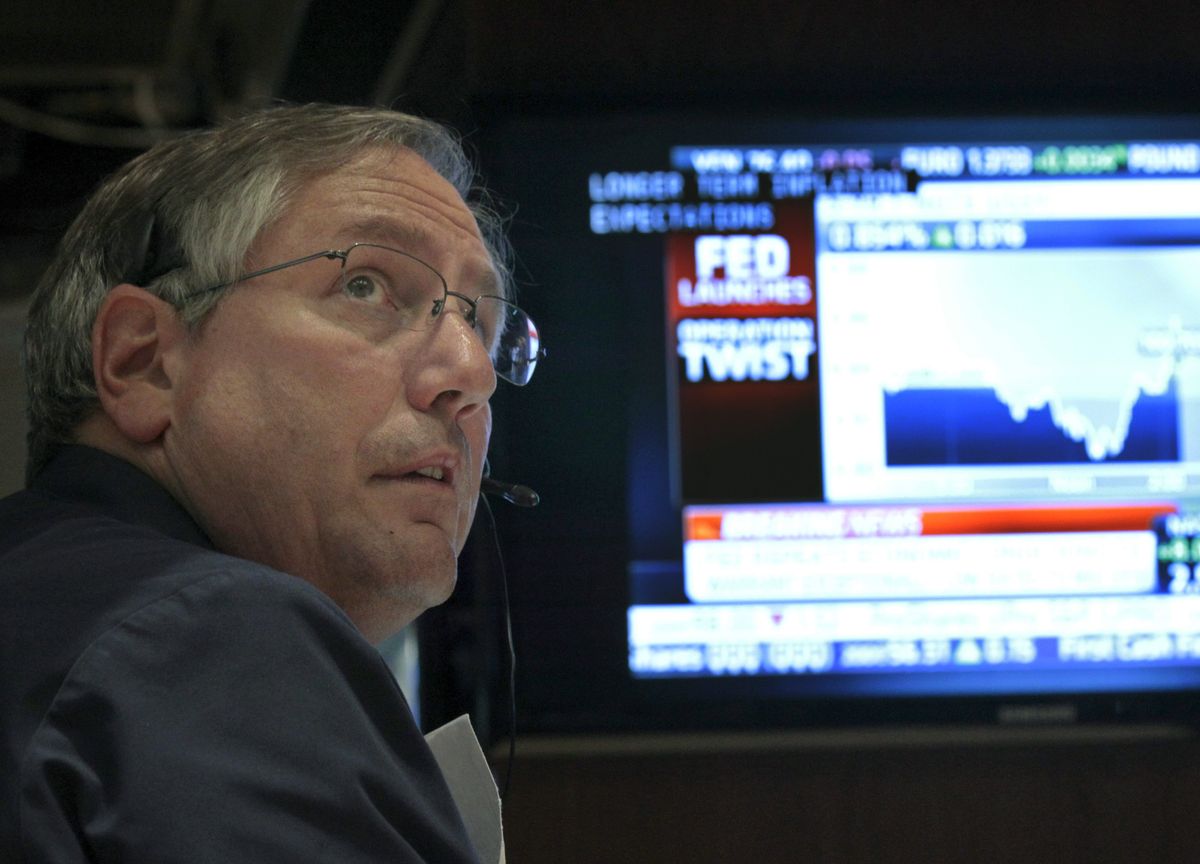 Trader Warren Meyers watches the Fed Rate announcement on the floor of the New York Stock Exchange