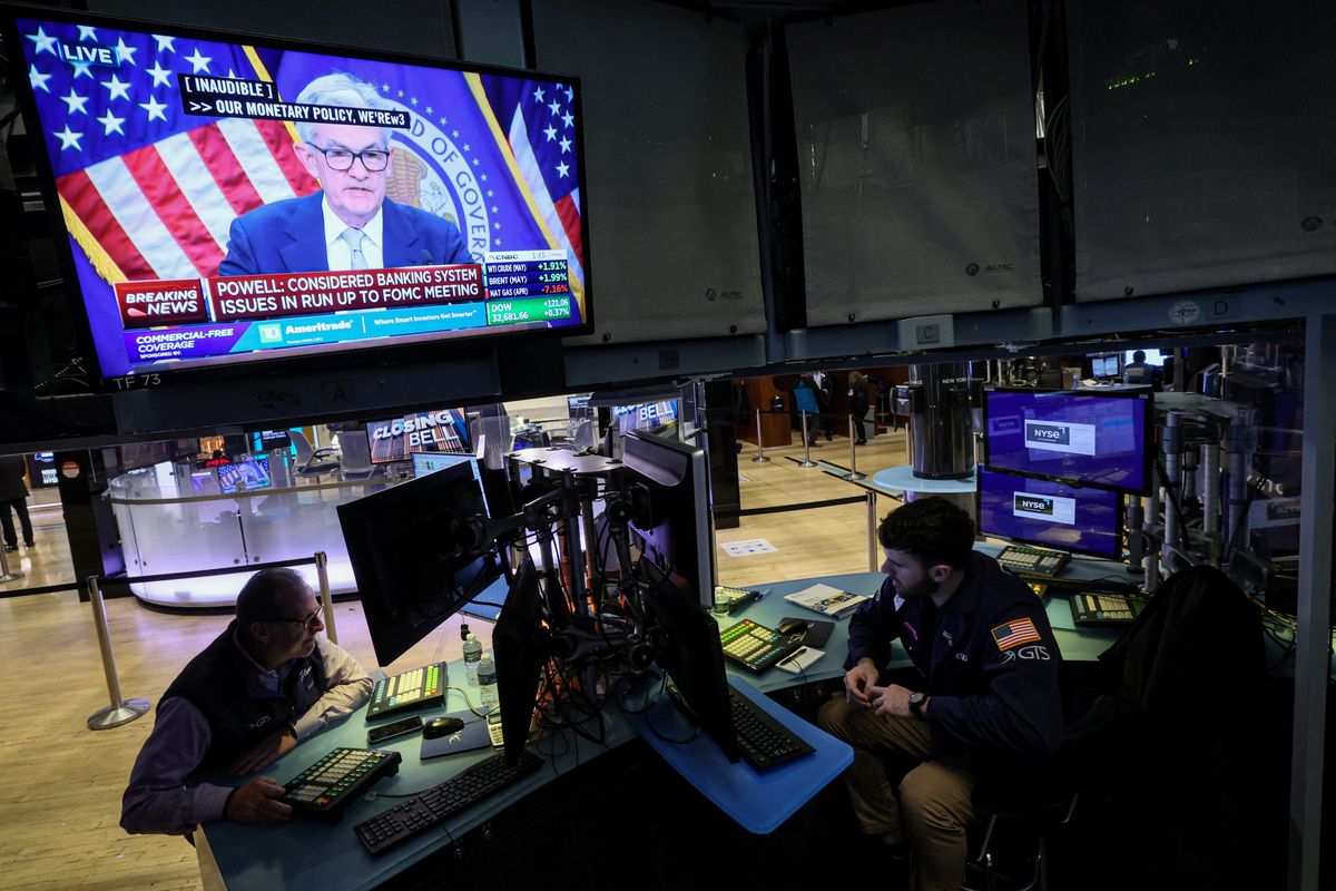 Traders react to Fed rate announcement on the floor of the NYSE in New York. 