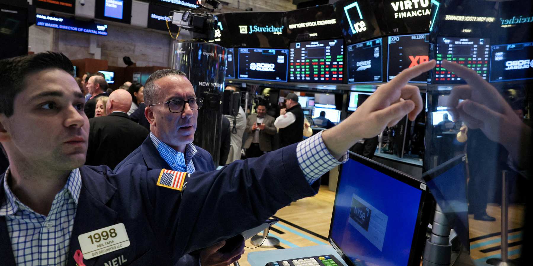 Traders work on the floor at the New York Stock Exchange in New York City.