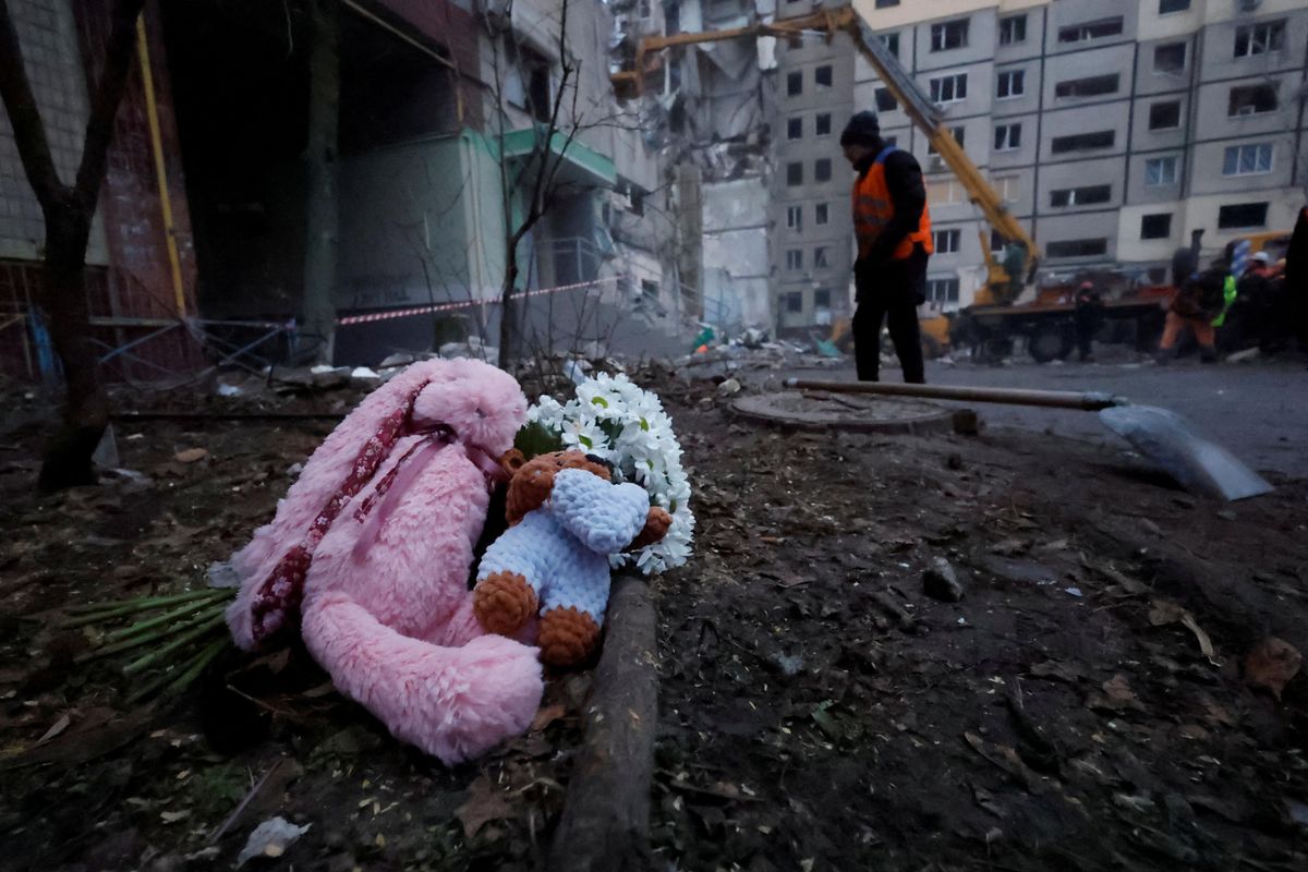 Tributes are left at the site where an apartment block was heavily damaged by a Russian missile strike in Dnipro, Ukraine.