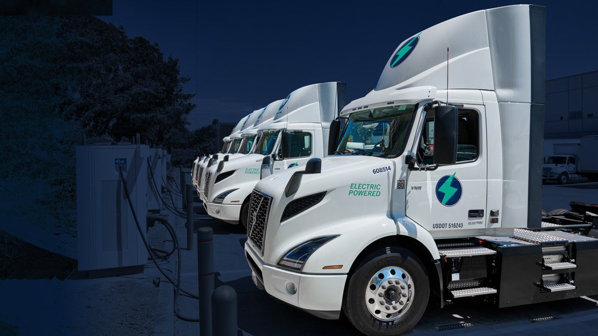 Trucks pulled up to EV chargers