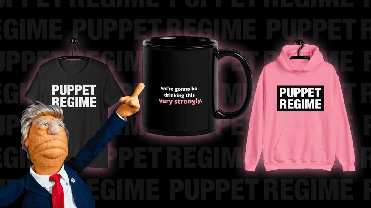 Trump puppet pointing at a tshirt, a mug, and a pink hoodie
