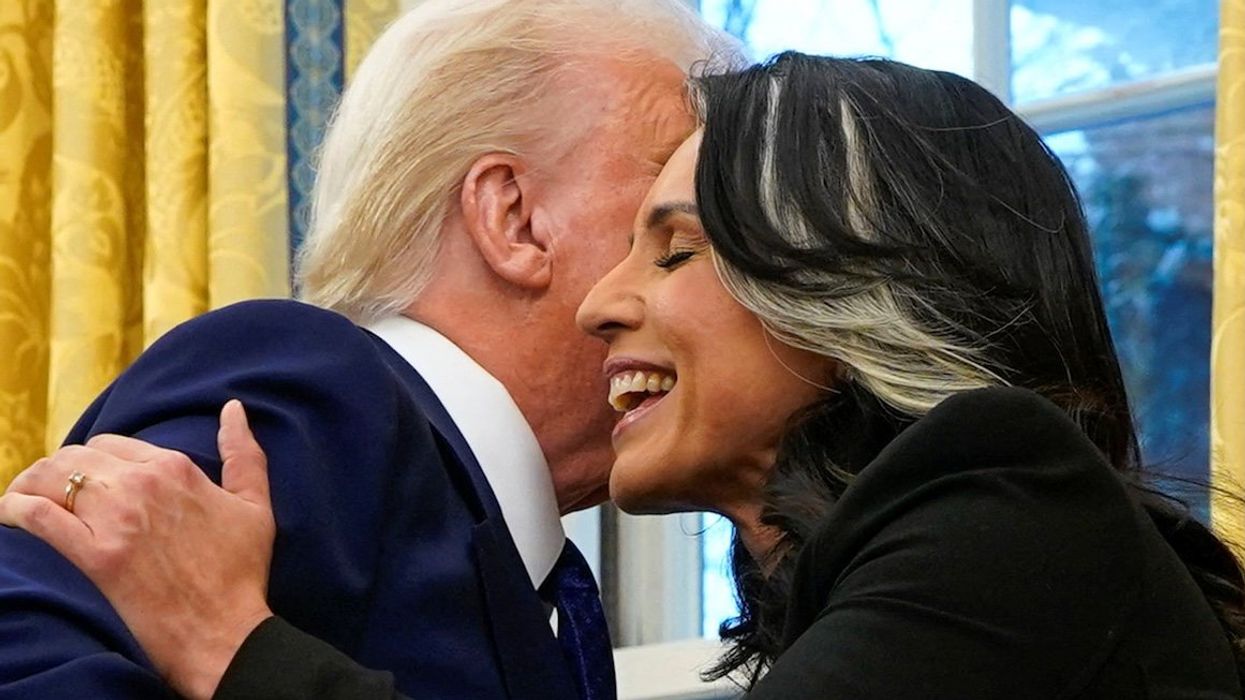Tulsi Gabbard hugs President Donald Trump in the Oval Office at the White House in Washington, D.C., on Feb. 12, 2025.