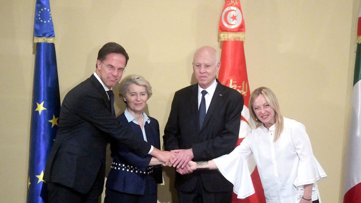 Tunisia's President Kais Saied, Italian Prime Minister Giorgia Meloni, European Commission President Ursula von der Leyen, and Dutch Prime Minister Mark Rutte shake hands during the signing of a "strategic partnership"