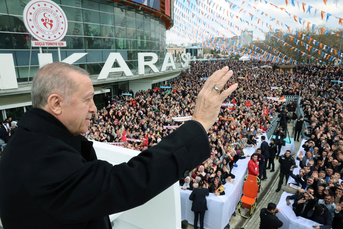 Turkish President Tayyip Erdogan greets the crowd before a meeting of his ruling AK Party to announce the party's election manifesto ahead of the May 14 elections, in Ankara, Turkey April 11, 2023.