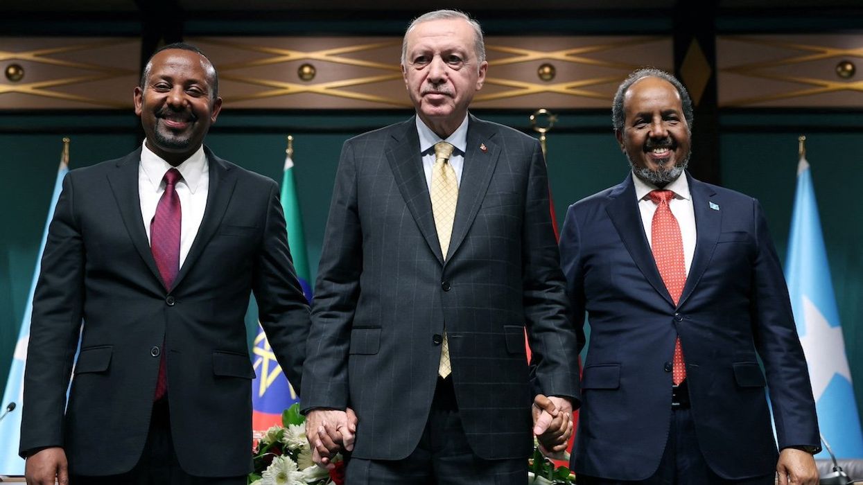 Turkish President Tayyip Erdogan poses with Somali President Hassan Sheikh Mohamud and Ethiopian Prime Minister Abiy Ahmed following a press conference in Ankara, Turkey, December 11, 2024.