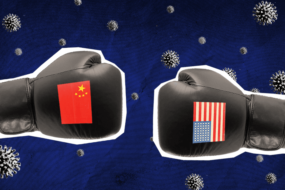 two boxing gloves facing each other; left glove has China flag and right glove has USA flag