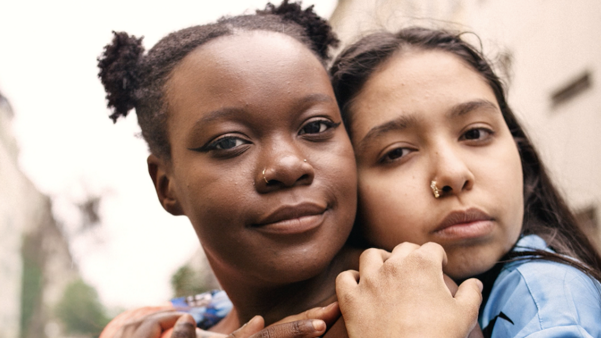 Two girls hugging - A $1.25B investment in advancing equality and economic opportunity