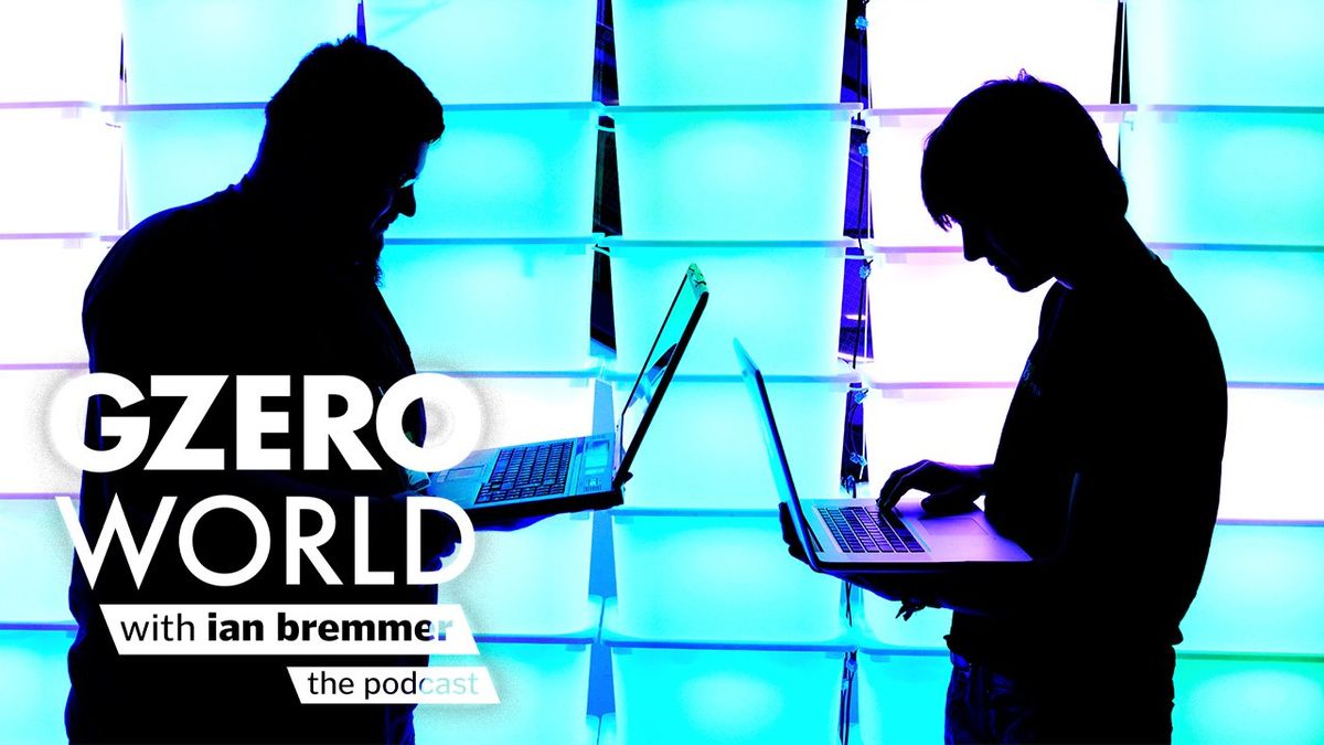 Two men focusing on their laptop computers with the GZERO World with Ian Bremmer - the podcast logo