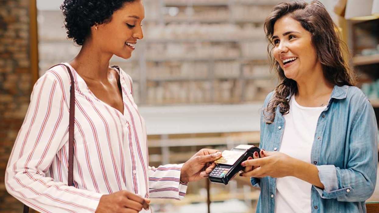 Two women making a monetary transaction