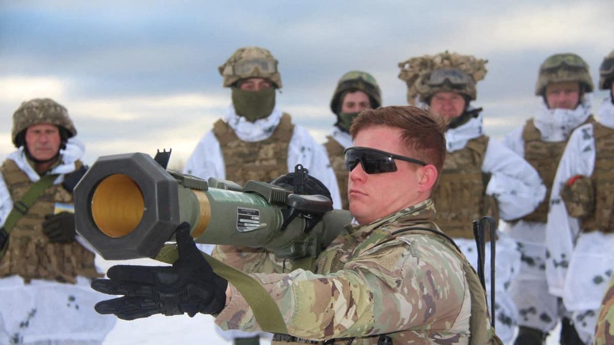 U.S. army instructor from the Joint Multinational Training Group trains Ukrainian service members to operate with M141 Bunker Defeat Munition (SMAW-D) grenade launcher, supplied by the United States, at a shooting range in Lviv Region, Ukraine, in this handout picture released January 30, 2022.