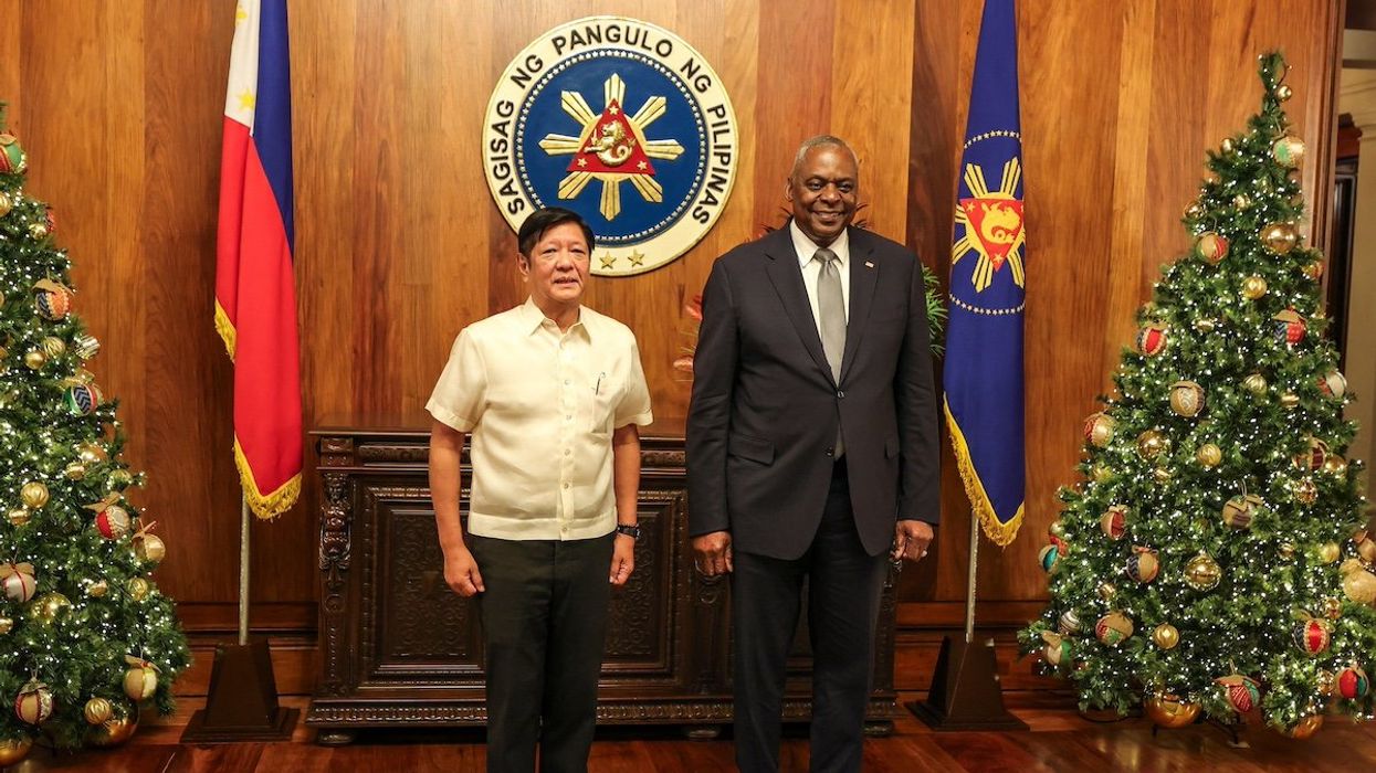 U.S. Defense Secretary Lloyd Austin poses with Philippine President Ferdinand Marcos Jr during a courtesy call at the Malacanang Palace in Manila, Philippines, November 18, 2024.