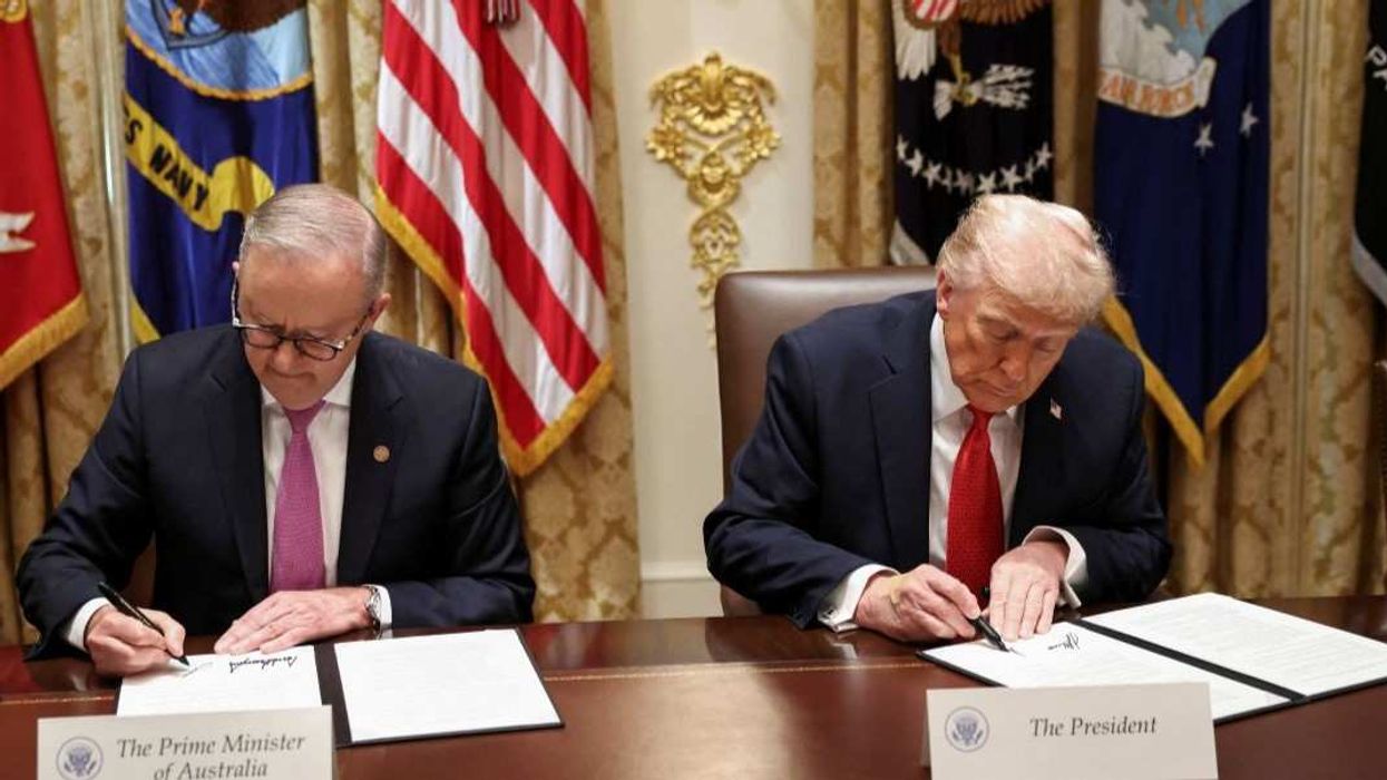 U.S. President Donald Trump and Australia's Prime Minister Anthony Albanese sign an agreement on rare earth and critical minerals during a meeting in the Cabinet Room at the White House, in Washington, D.C., U.S., October 20, 2025.