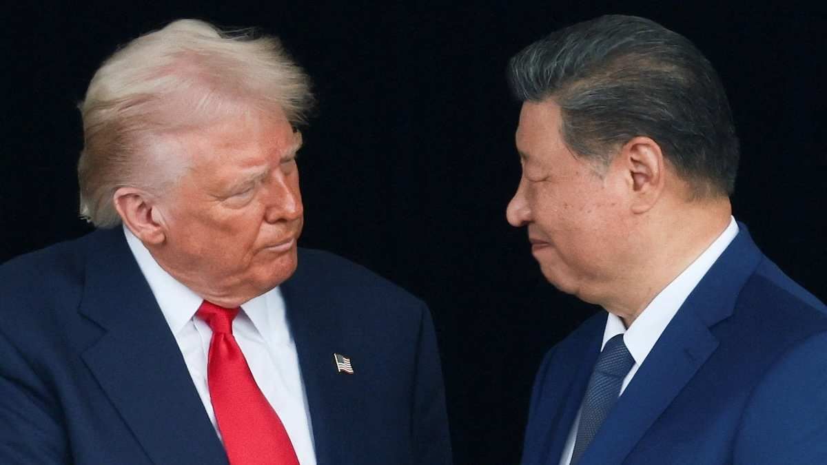 U.S. President Donald Trump and Chinese President Xi Jinping talk as they leave after a bilateral meeting.