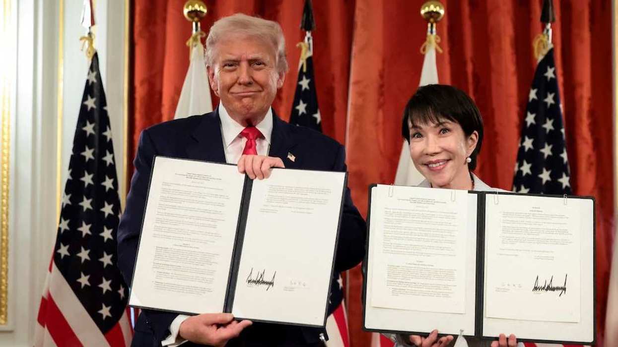 U.S. President Donald Trump and Japanese Prime Minister Sanae Takaichi hold up signed documents regarding securing the supply of critical minerals and rare earths, at a bilateral meeting at Akasaka Palace in Tokyo, Japan, October 28, 2025.