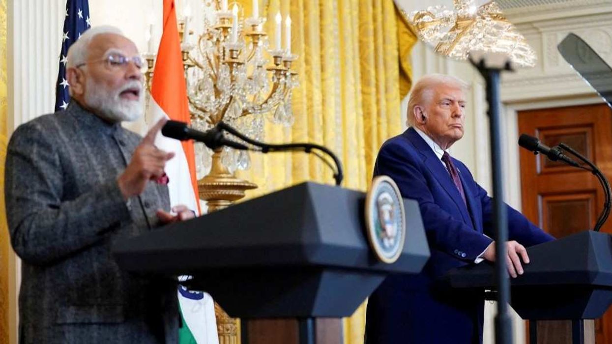 U.S. President Donald Trump listens as Indian Prime Minister Narendra Modi speaks during a joint press conference at the White House in Washington, D.C., U.S., February 13, 2025.