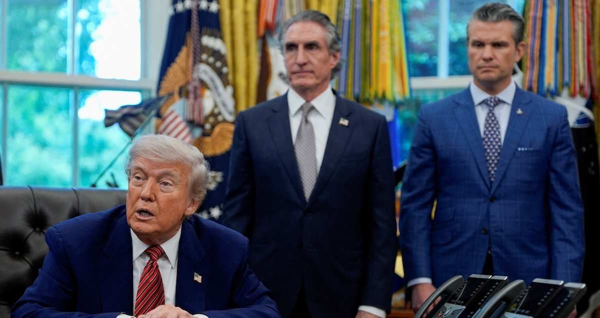 ​U.S. President Donald Trump speaks in the Oval Office, as U.S. Defense Secretary Pete Hegseth and Secretary of the Interior Doug Burgum look on, on the day he signs an executive order, at the White House in Washington, D.C., U.S., May 23, 2025. 