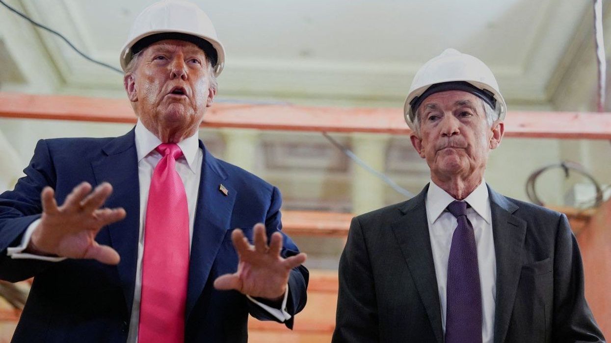 U.S. President Donald Trump speaks next to Federal Reserve Chair Jerome Powell during a tour of the Federal Reserve Board building, which is currently undergoing renovations, in Washington, D.C., U.S., July 24, 2025.