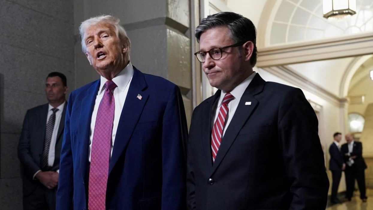U.S. President Donald Trump speaks next to U.S. House Speaker Mike Johnson (R-LA), on the day of a closed House Republican Conference meeting on Capitol Hill in Washington, D.C., U.S., May 20, 2025.