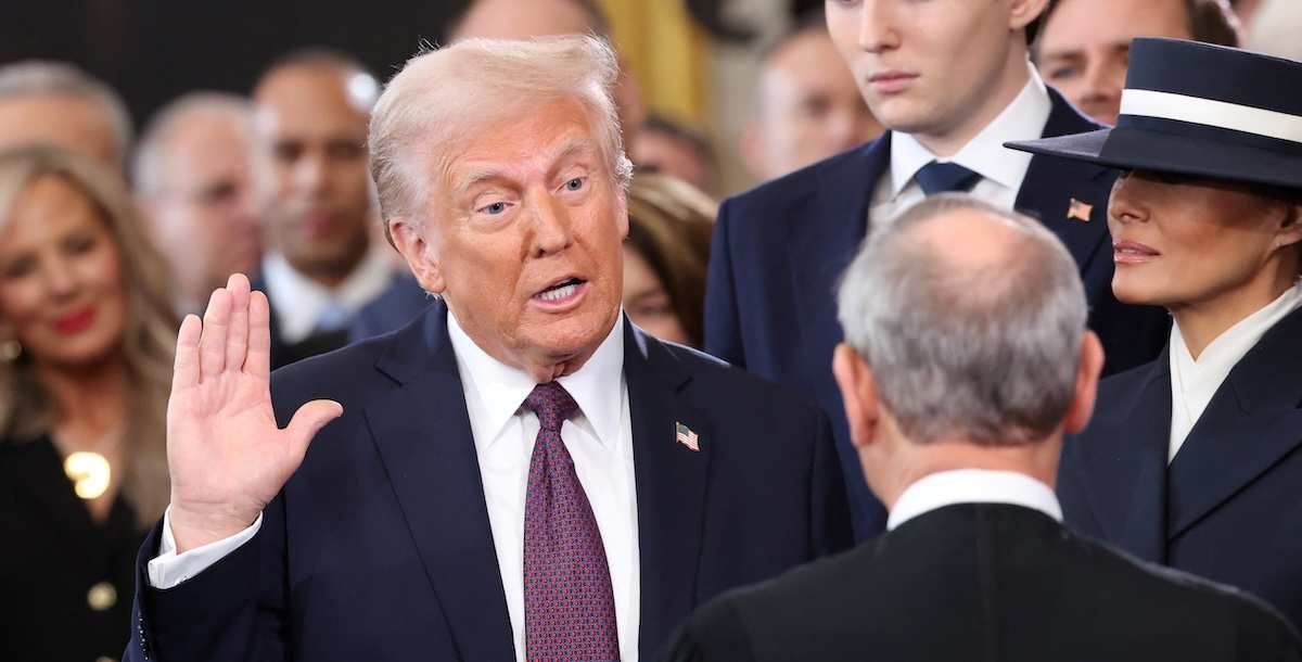 ​U.S. President Donald Trump takes oath as Barron Trump and Melania Trump look on the day of his Presidential Inauguration at the Rotunda of the U.S. Capitol in Washington, U.S., January 20, 2025. 