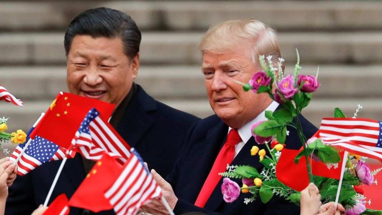 U.S. President Donald Trump takes part in a welcoming ceremony with China's President Xi Jinping at the Great Hall of the People in Beijing, China, November 9, 2017.