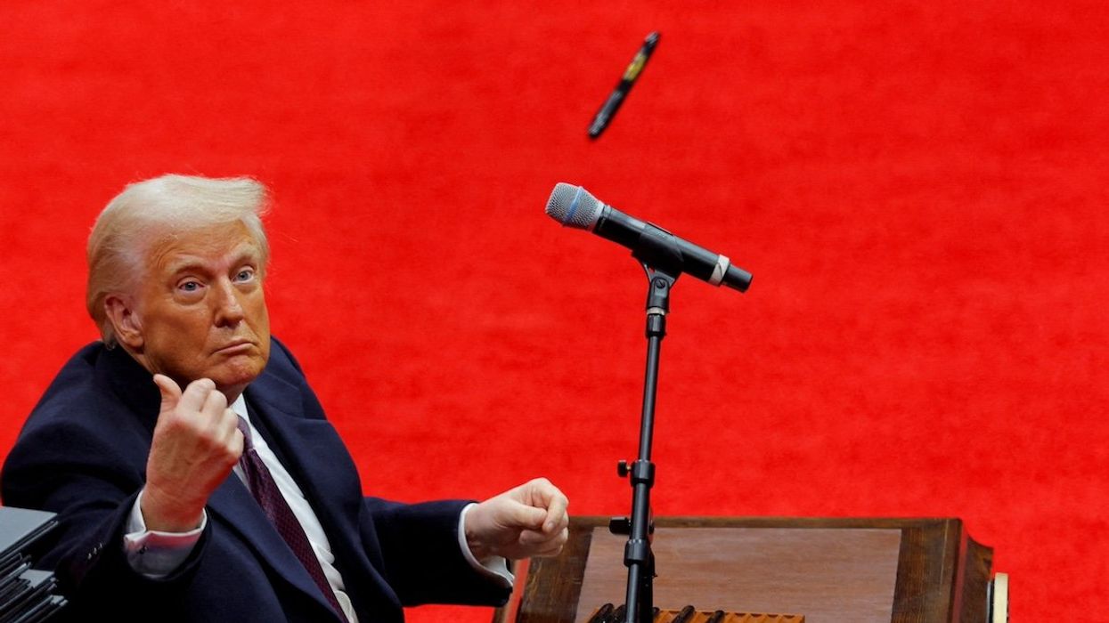 U.S. President Donald Trump throws a pen after he signed executive orders on the inauguration day of Trump's second Presidential term, inside Capital One Arena, in Washington, U.S. January 20, 2025.